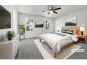 Cozy main bedroom with plush carpet, natural light, and contemporary decor at 68 Silverthorne Pass, Douglasville, GA 30134