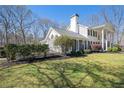 Charming home with detailed brick accents and manicured landscaping, offering a blend of comfort and elegance at 5430 Burdette Se Rd, Mableton, GA 30126