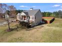 View of the side of the home featuring a large lawn and a wooden fence at 363 Safe Harbor Dr, Dallas, GA 30157