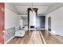 Open living room with a fireplace, high ceilings, and hardwood floors at 363 Safe Harbor Dr, Dallas, GA 30157