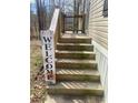 Welcoming front porch with wooden steps leading to the entrance at 53 Oakview Dr, Carrollton, GA 30116
