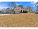 Traditional two-story home featuring a two-car garage and inviting front yard at 539 Villa Rosa Rd, Temple, GA 30179