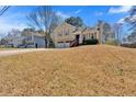 Charming two-story home with a two car garage and a grassy front yard at 539 Villa Rosa Rd, Temple, GA 30179