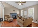 Cozy living room with fireplace and hardwood floors at 539 Villa Rosa Rd, Temple, GA 30179