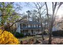 Attractive two-story home featuring a welcoming front porch and a picturesque setting at 959 Hampton Nw Trl, Lilburn, GA 30047