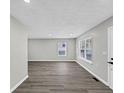 Spacious room with hardwood flooring, light paint, and a window at 2478 Verbena Nw Cir, Atlanta, GA 30314