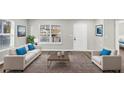 Bright living room with modern decor, large windows and stylish furniture at 2478 Verbena Nw Cir, Atlanta, GA 30314