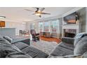 Cozy living room features a fireplace, comfortable seating, and lots of natural light at 2845 Englewood Dr, Cumming, GA 30040