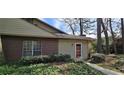 Attractive home exterior with a brick facade and meticulously kept landscaping at 4858 Westridge Dr, Norcross, GA 30093