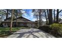 Inviting home with a brick facade, complemented by a well-manicured front lawn at 4858 Westridge Dr, Norcross, GA 30093