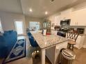 Well-equipped kitchen with stainless steel appliances, granite countertops, and bright white cabinets at 8325 Loch Lomand Ln, Winston, GA 30187