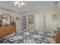 Inviting main bedroom with a ceiling fan, dresser, and ensuite bathroom entrance at 507 Mockingbird Ln, Loganville, GA 30052