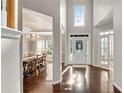 Grand entrance featuring hardwood floors, a chandelier, and an open view into the dining room at 3015 Foxhall Overlook, Roswell, GA 30075
