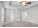 Spacious main bedroom with tray ceilings and neutral tones at 3575 Bonneville Dr, Cumming, GA 30041