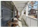 Relaxing covered front porch with string lights and cozy hammock seating at 109 Chester Se Ave, Atlanta, GA 30316
