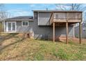 Spacious backyard featuring a raised wooden deck, and ample green space at 1575 Kelleys Close, Stone Mountain, GA 30088