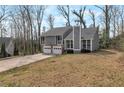 Residential house with attractive curb appeal and a well-kept front yard at 1575 Kelleys Close, Stone Mountain, GA 30088