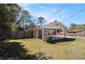 Home exterior with carport and fenced yard with healthy green grass at 2131 Columbia Dr, Decatur, GA 30032