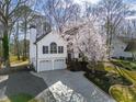 Attractive two-story home with a spacious driveway and landscaped yard, showcasing beautiful curb appeal at 210 Barrett Springs Way, Canton, GA 30115