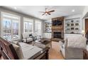 Inviting living room featuring a stone fireplace, built-in shelves, and ample seating at 129 Euharlee 5 Forks Rd, Euharlee, GA 30145