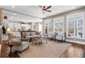 Bright living room flows into kitchen with large windows and neutral decor at 129 Euharlee 5 Forks Rd, Euharlee, GA 30145