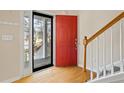 View of the front door, wood floors, and an open view of the neighborhood at 55 Legend Creek Cove, Douglasville, GA 30134