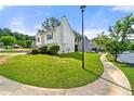 Two-story home featuring a well-maintained lawn and mature landscaping at 125 Fairhaven Trl, Fairburn, GA 30213