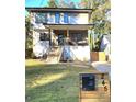Modern two-story home with covered porch, landscaped yard, and charming curb appeal in a residential setting at 245 Mathewson Pl, Atlanta, GA 30314