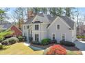 Charming home featuring lush landscaping and a well-maintained lawn at 2867 Watchtower Approach Nw, Marietta, GA 30064