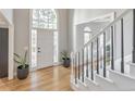 Inviting foyer with hardwood floors, staircase, and large front door with sidelights at 2867 Watchtower Approach Nw, Marietta, GA 30064