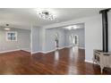 Bright living room with beautiful hardwood floors, modern light fixtures, and fresh paint at 621 Spruce Dr, Stone Mountain, GA 30083