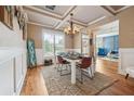 Well-lit dining room featuring stylish decor, hardwood floors, and a comfortable dining set at 1249 Austin Thomas Dr, Dacula, GA 30019
