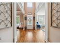 Inviting foyer with hardwood floors, decorative accents, and views of the living spaces at 1249 Austin Thomas Dr, Dacula, GA 30019
