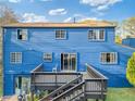 Backyard view showcasing a deck and slider door at 2224 Bridle Ct, Norcross, GA 30071