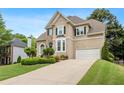 Well-maintained home boasting a stone facade, an attached two-car garage, and pristine landscaping at 3640 Ridgeway Ter, Suwanee, GA 30024