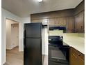 Kitchen with sleek black appliances at 942 Ellison Ct, Austell, GA 30168