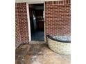 Exterior showing red brick wall and yellow brick planters on the outdoor porch at 1581 Se Woodland Se Cir, Atlanta, GA 30316