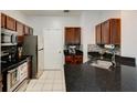 Updated kitchen with stainless steel appliances, dark cabinetry and a tile backsplash at 5641 Roswell Rd # 307, Sandy Springs, GA 30342