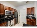 Updated kitchen with stainless steel appliances, dark cabinetry and a tile backsplash at 5641 Roswell Rd # 307, Sandy Springs, GA 30342