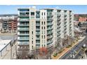 Multi-story condo building showing balconies and city views in an urban setting at 1100 Howell Mill Nw Rd # 613, Atlanta, GA 30318