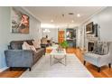 Cozy living room and dining area with hardwood floors, modern furnishings, and plenty of natural light at 214 Ridley Howard Ct, Decatur, GA 30030