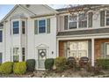Traditional-style townhouse featuring white siding, bay window, and a charming front entrance at 2015 Kilmington Sq, Alpharetta, GA 30009
