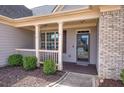 Inviting front porch with classic design elements, perfect for relaxing outdoors at 27 Spring Folly Nw, Cartersville, GA 30121