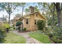 Landscaped backyard featuring a stone path and a well-maintained lawn at 434 Euclid Ne Ter, Atlanta, GA 30307