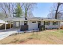 Well-maintained home with a covered carport and tidy front yard at 4985 Crowe Se Dr, Smyrna, GA 30082