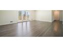 Bright living room featuring attractive hardwood floors and access to the outdoors at 4985 Crowe Se Dr, Smyrna, GA 30082