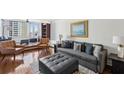 Cozy living room boasts hardwood floors, large windows, and comfortable seating arrangements at 215 Piedmont Ne Ave # 2109, Atlanta, GA 30308