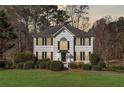 Charming two-story home with black shutters and lush landscaping at 434 Westchester Way, Canton, GA 30115