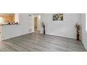 View of an open-concept living room with hardwood floors and light neutral-painted walls at 3665 Chestnut Dr # A2, Atlanta, GA 30340