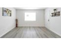 View of a naturally lit living room featuring neutral paint and hard wood floors at 3665 Chestnut Dr # A2, Atlanta, GA 30340
